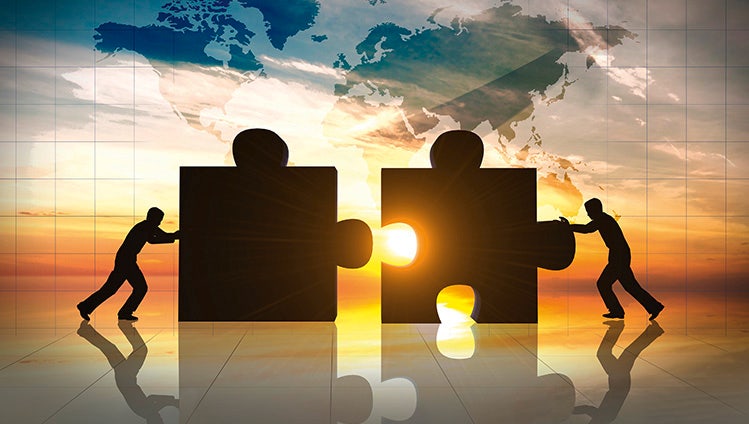 World Business teamwork puzzle pieces