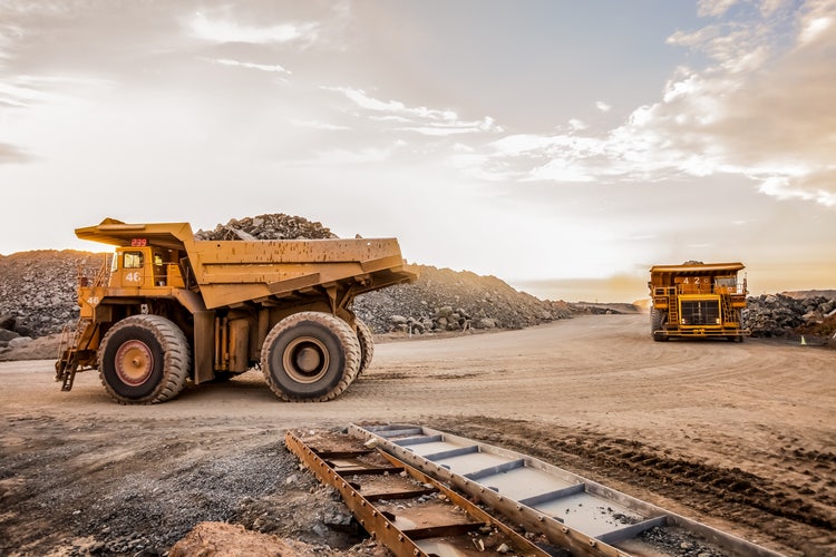 Dump Trucks transporting Platinum ore for processing