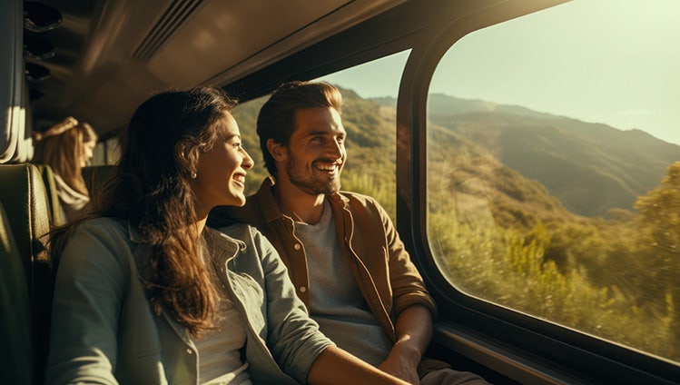 Couples enjoying a picturesque train journey amidst stunning natural scenery, Centered, symmetrical, shot on Cannon EOS 750D, uhd, perfect white balance, natural lighting --ar 16:9 --v 5.2 Job ID: 7e2f9c40-8f97-4ac7-9cfa-9effab6034c3